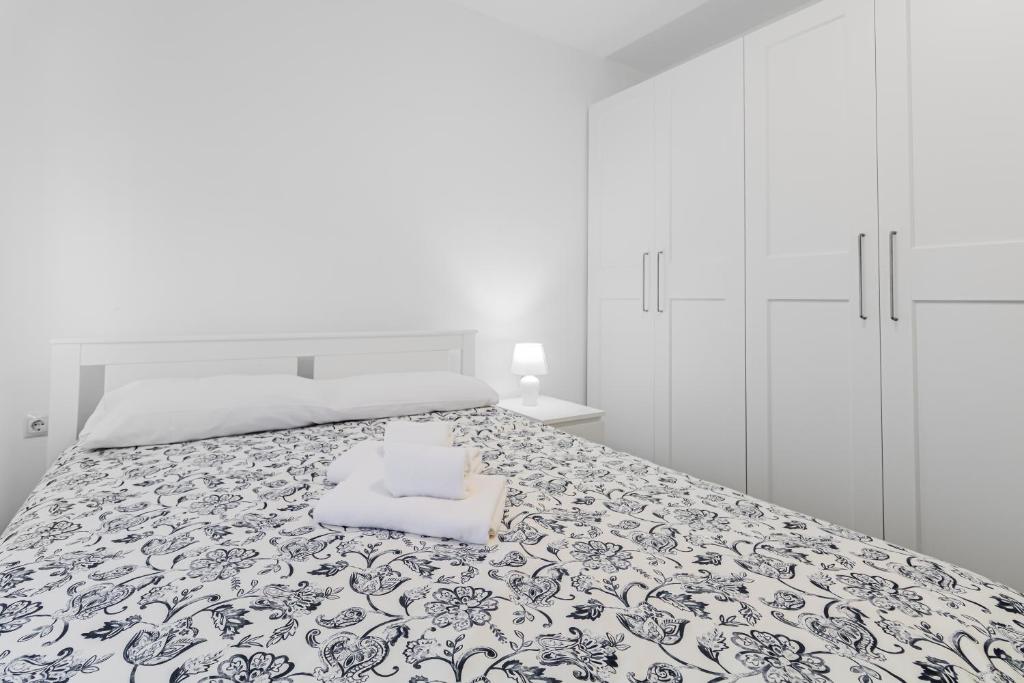 Postel nebo postele na pokoji v ubytování Urban Nest Suites