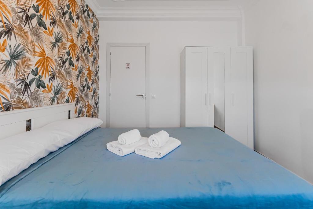 Postel nebo postele na pokoji v ubytování Urban Nest Suites