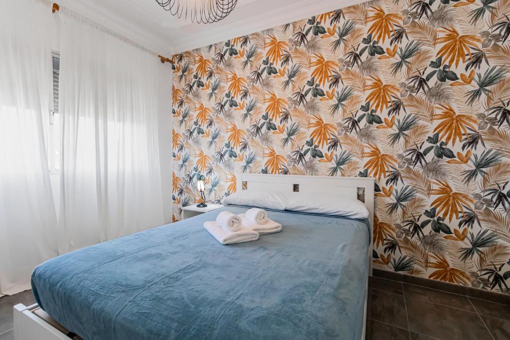 Postel nebo postele na pokoji v ubytování Urban Nest Suites