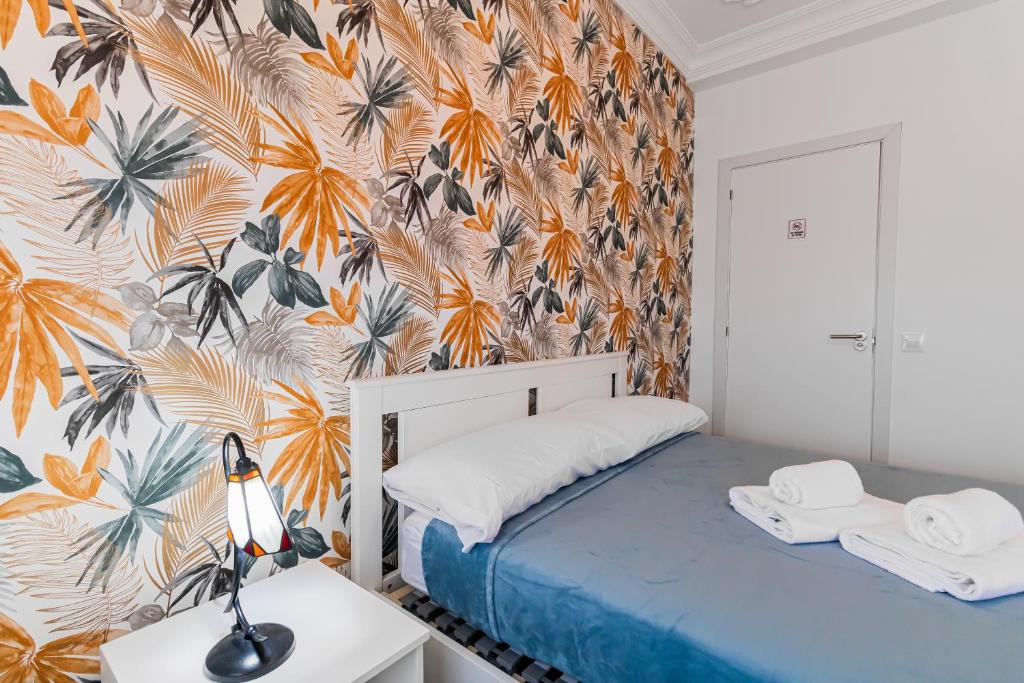 Postel nebo postele na pokoji v ubytování Urban Nest Suites