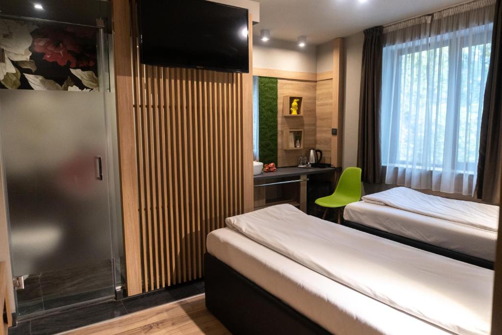 Postel nebo postele na pokoji v ubytování Hotel Allur