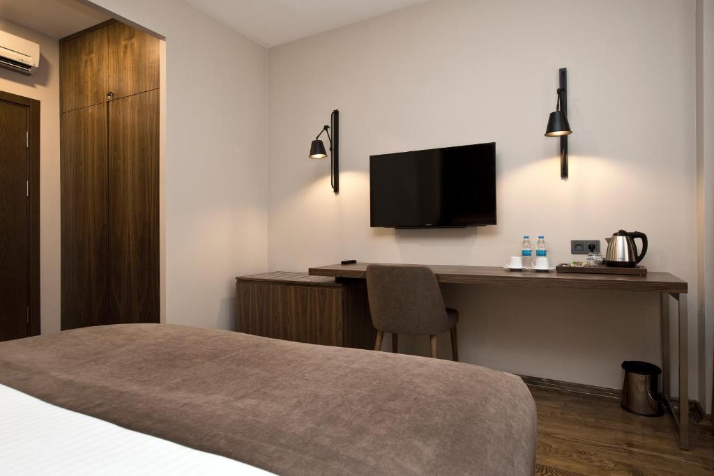 TV a/nebo společenská místnost v ubytování Snog Rooms & Suites