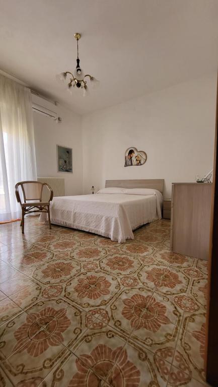 Giường trong phòng chung tại Vacanze a Ruffano