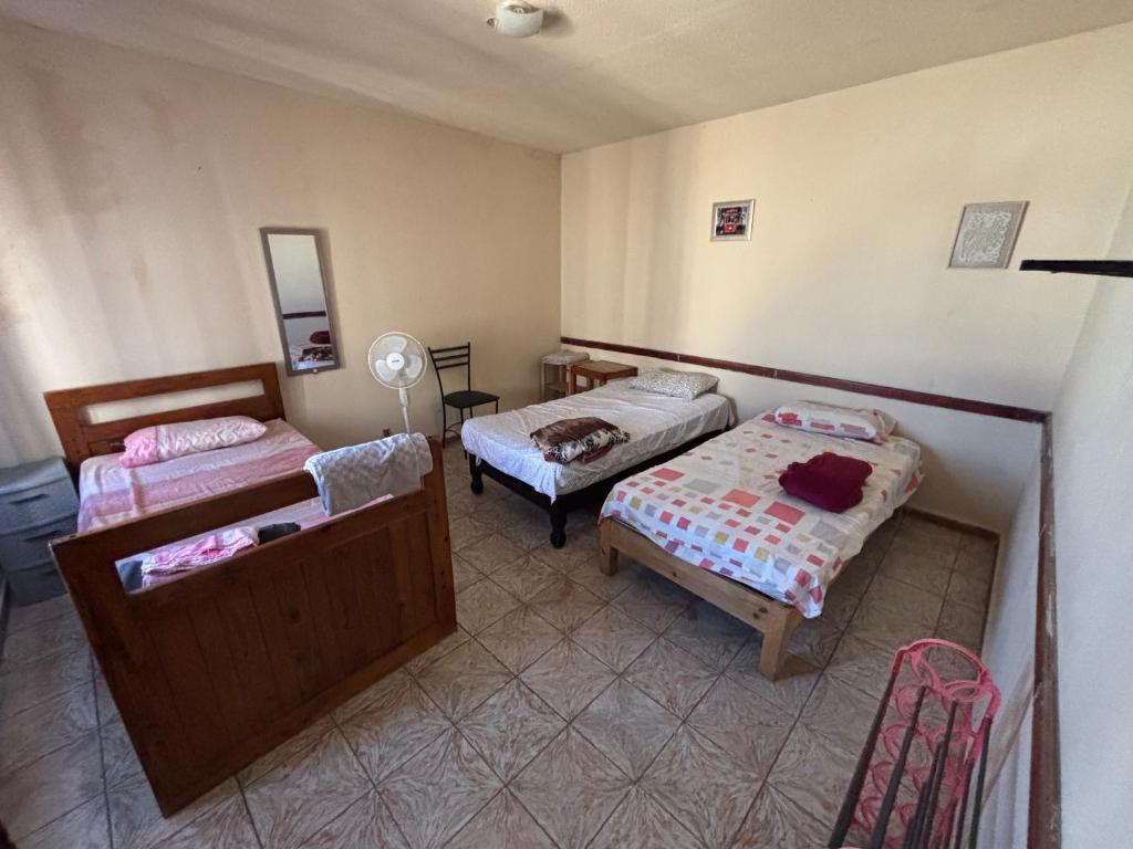 Postel nebo postele na pokoji v ubytování Hostal 509