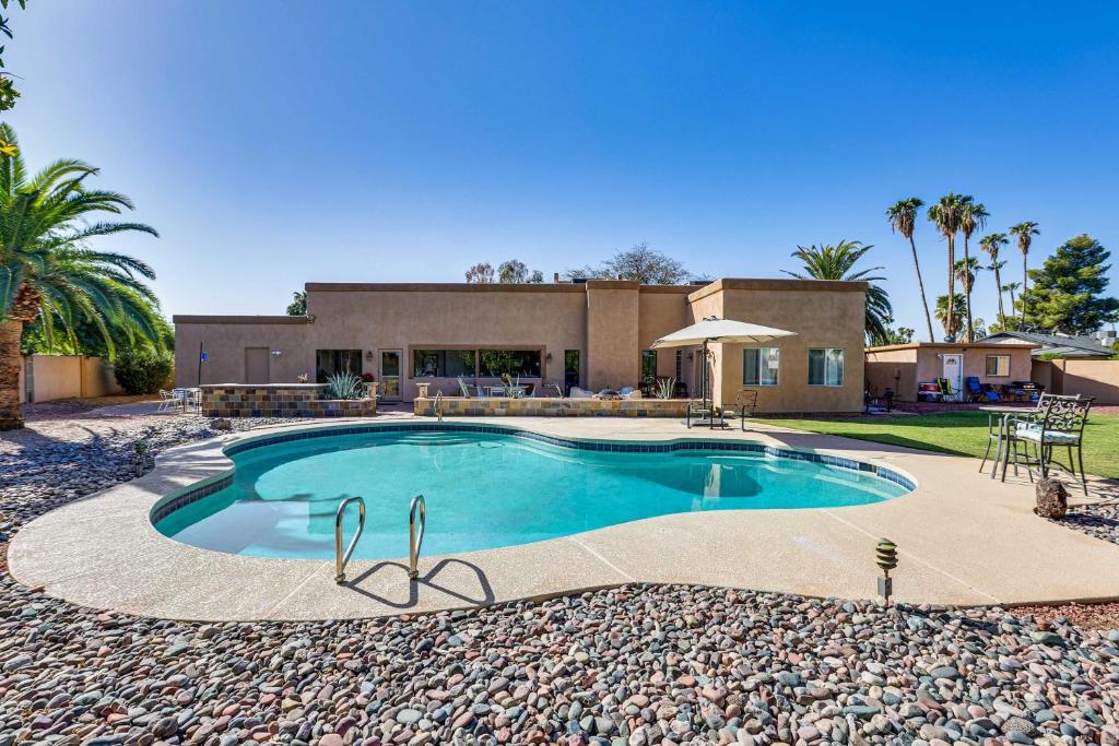 a swimming pool in front of a house at Scottsdale Biohack Healthy Dream Retreat! in Phoenix
