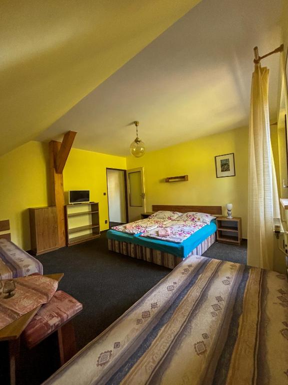 Postel nebo postele na pokoji v ubytování Dum Eva