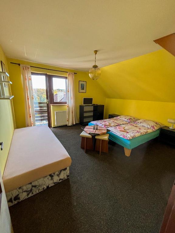Postel nebo postele na pokoji v ubytování Dum Eva