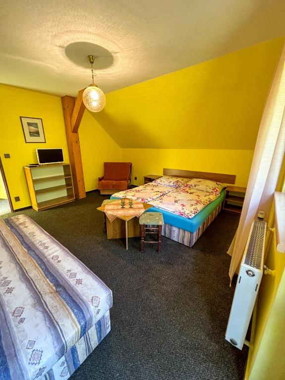 Postel nebo postele na pokoji v ubytování Dum Eva