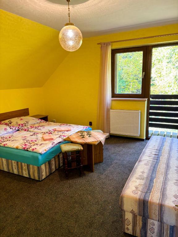 Postel nebo postele na pokoji v ubytování Dum Eva