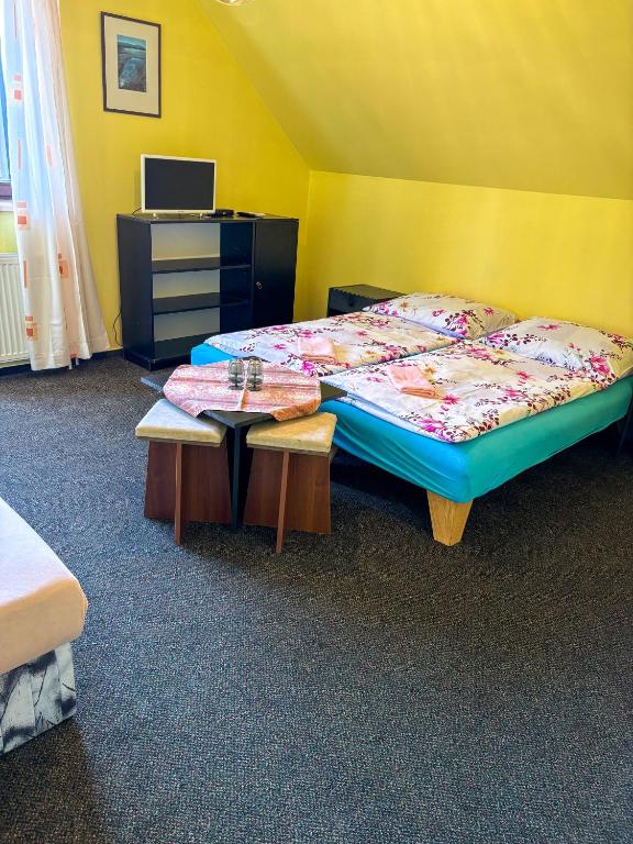 Postel nebo postele na pokoji v ubytování Dum Eva