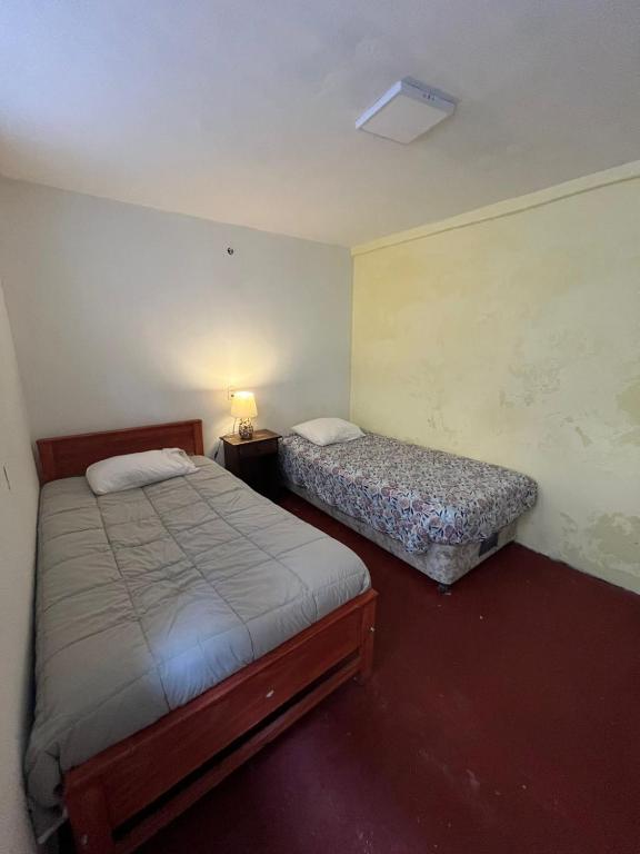 Postel nebo postele na pokoji v ubytování Hotel Nativo