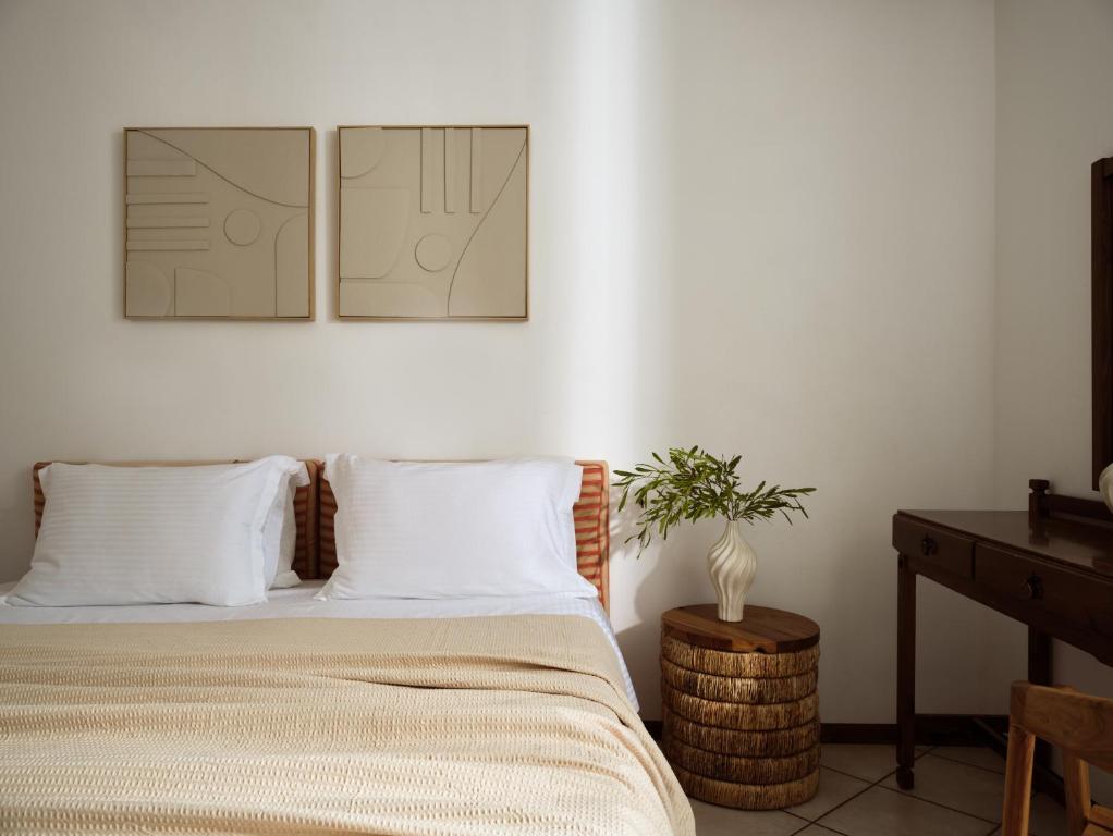 Ein Bett oder Betten in einem Zimmer der Unterkunft AQUARIUS HOTEL