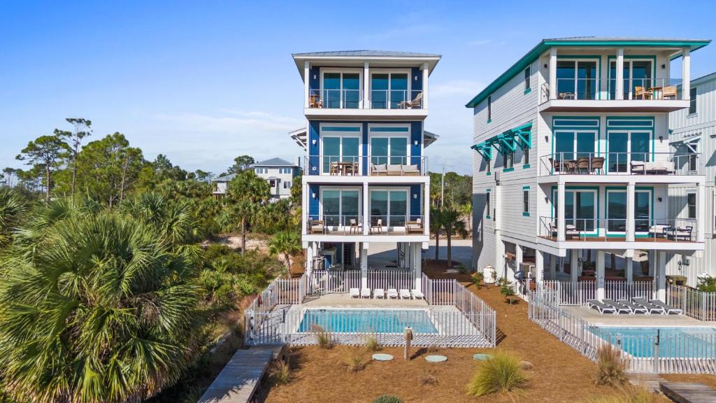 an aerial view of a building with a swimming pool at Pet Friendly Beach House - Starfish by Panhandle Getaways in Indian Pass