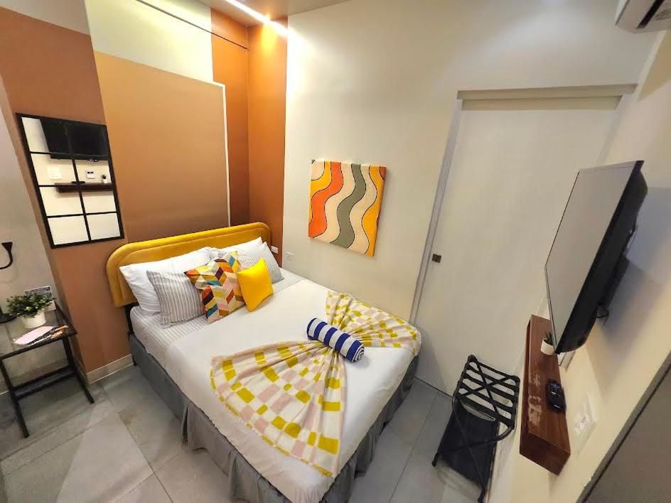Postel nebo postele na pokoji v ubytování Somos Hotel San Juan