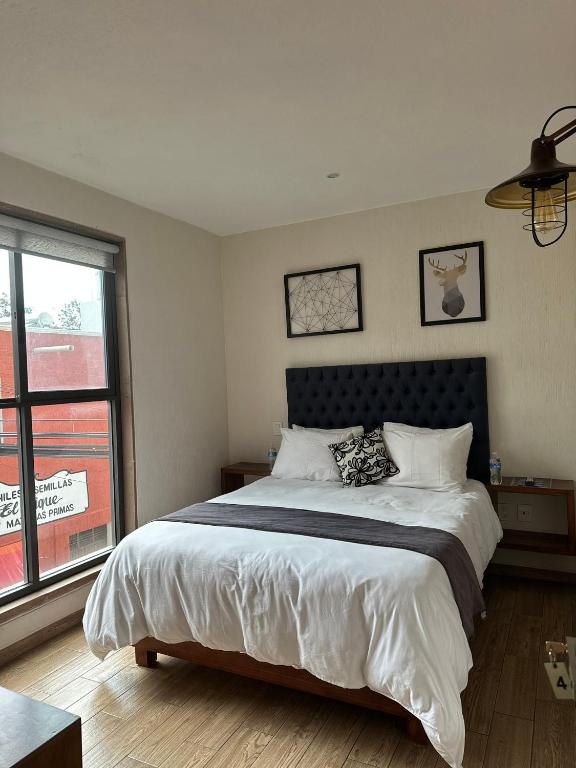 Postel nebo postele na pokoji v ubytování Hotel Del Valle