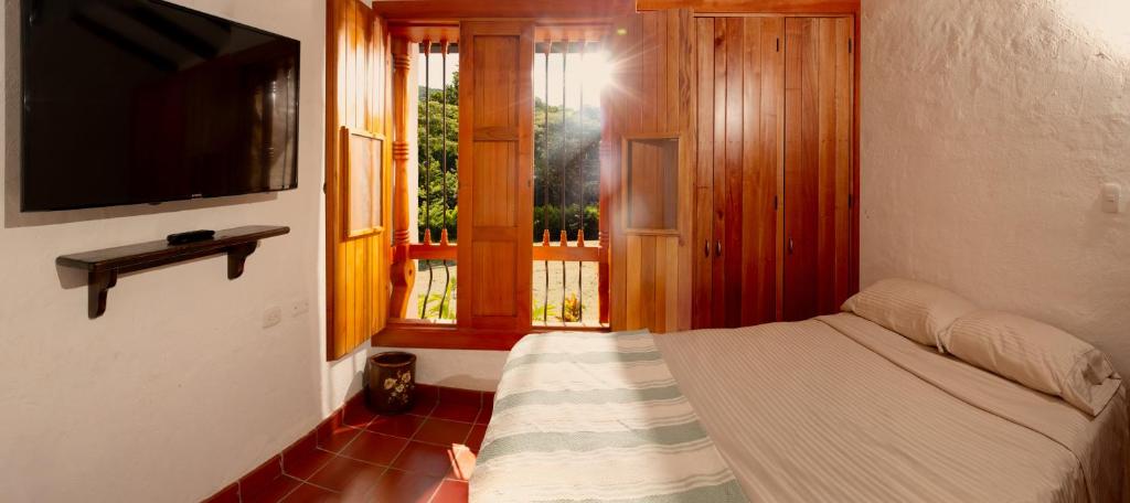 Postel nebo postele na pokoji v ubytování Hacienda La Tulia Eco Hotel
