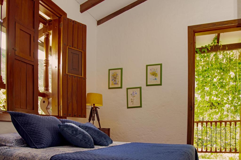 Postel nebo postele na pokoji v ubytování Hacienda La Tulia Eco Hotel