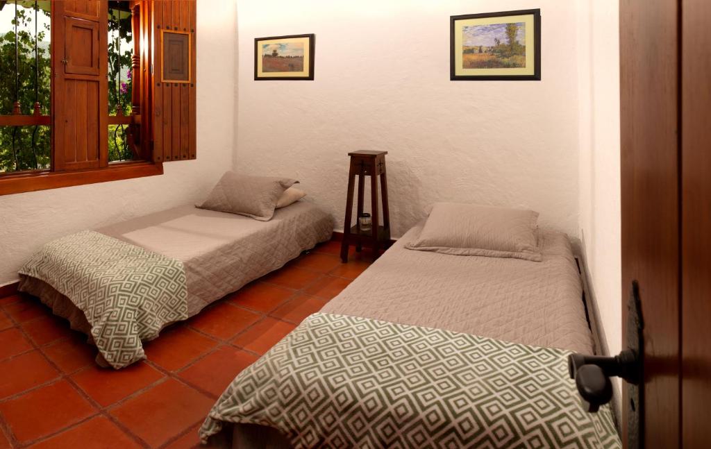 Postel nebo postele na pokoji v ubytování Hacienda La Tulia Eco Hotel