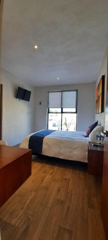 Postel nebo postele na pokoji v ubytování Hotel Del Valle