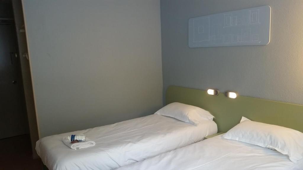Postel nebo postele na pokoji v ubytování Hotel Inn Design Moutiers