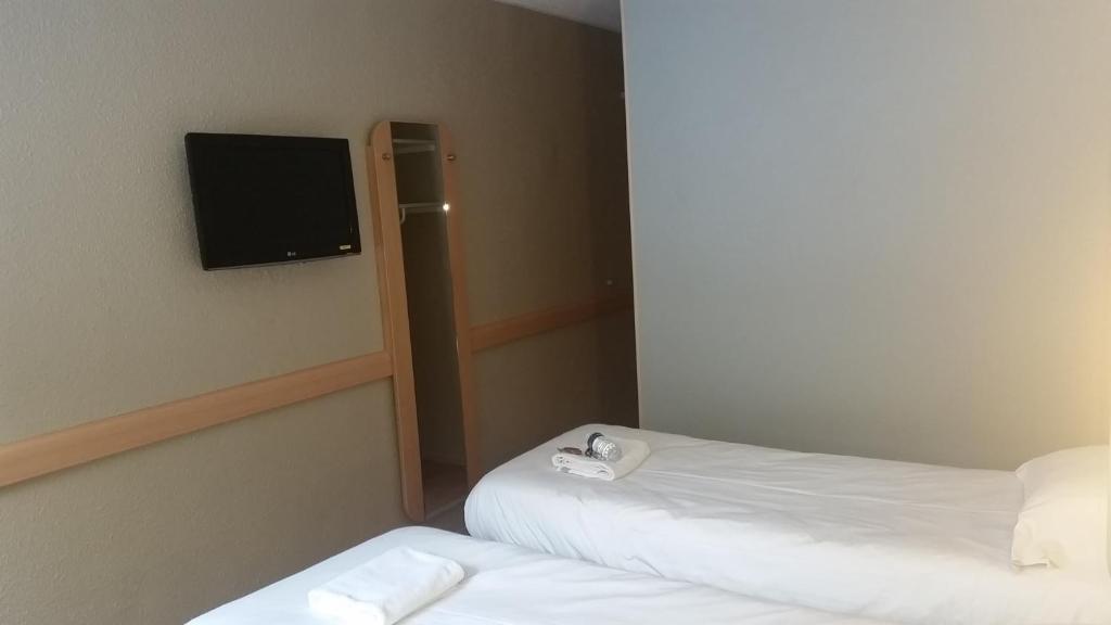 Postel nebo postele na pokoji v ubytování Hotel Inn Design Moutiers