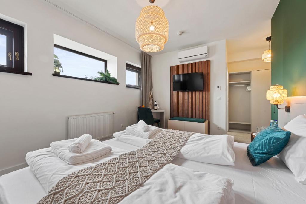 Postel nebo postele na pokoji v ubytování VIVE Hotel & Restaurant Vienna
