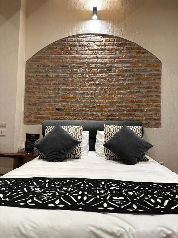 Postel nebo postele na pokoji v ubytování Hotel Del Valle