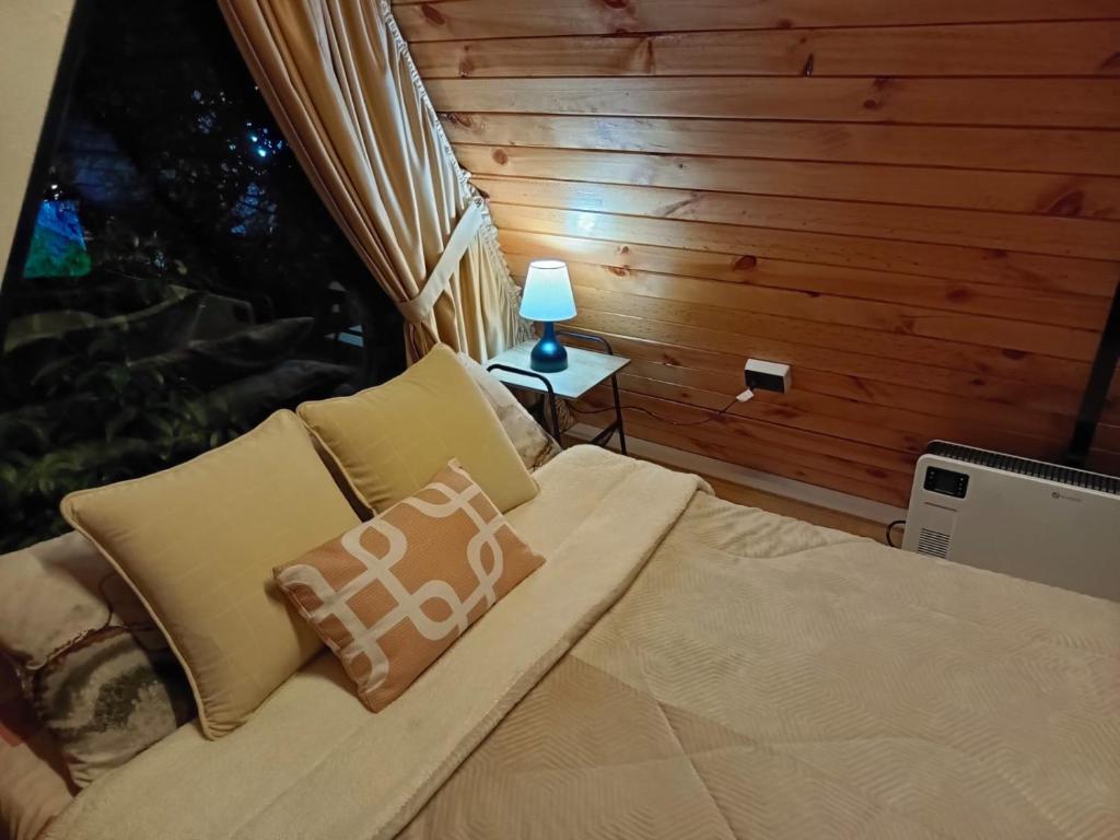 Postel nebo postele na pokoji v ubytování Hotel Ciudad Ambato