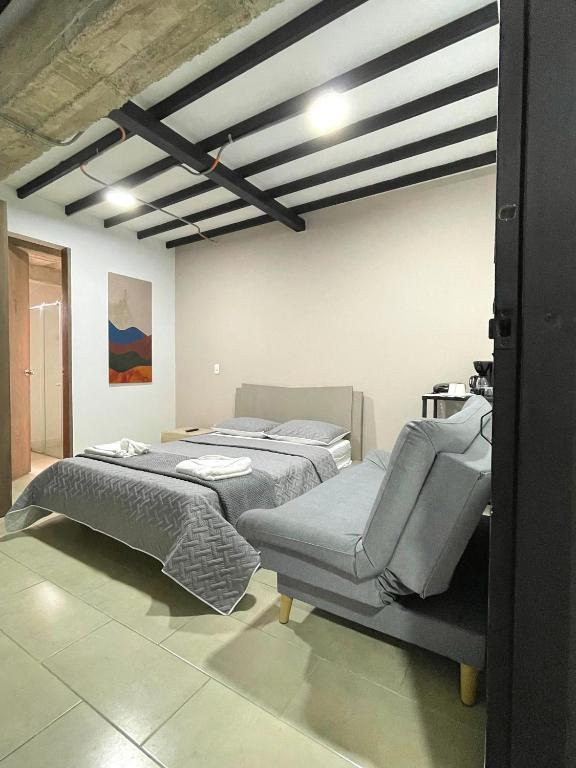 Postel nebo postele na pokoji v ubytování M1145 Aparta Loft