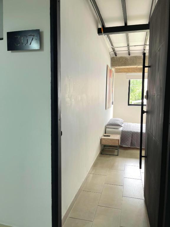 Postel nebo postele na pokoji v ubytování M1145 Aparta Loft