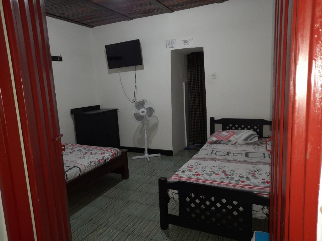 Llit o llits en una habitació de Posada San Carlos