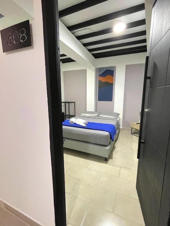 Postel nebo postele na pokoji v ubytování M1145 Aparta Loft