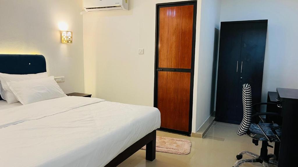 Postel nebo postele na pokoji v ubytování Orange Sky Inn