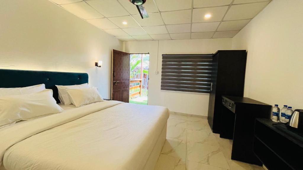Postel nebo postele na pokoji v ubytování Orange Sky Inn