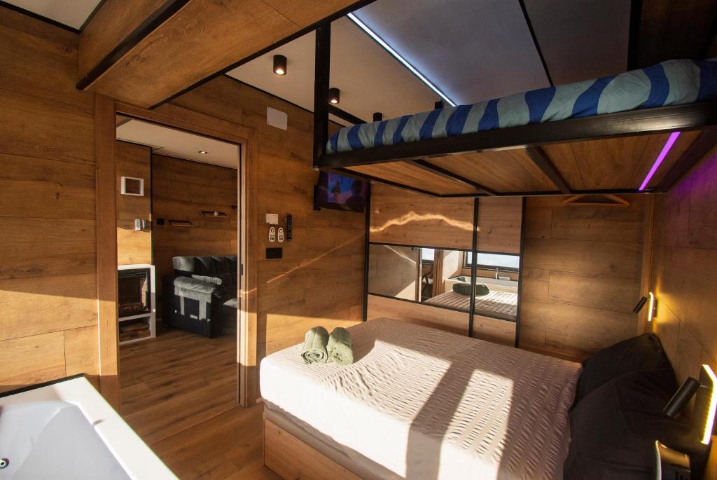 a bedroom with a bed in a room at SnowGranada Love Snow Jacuzzi in Sierra Nevada