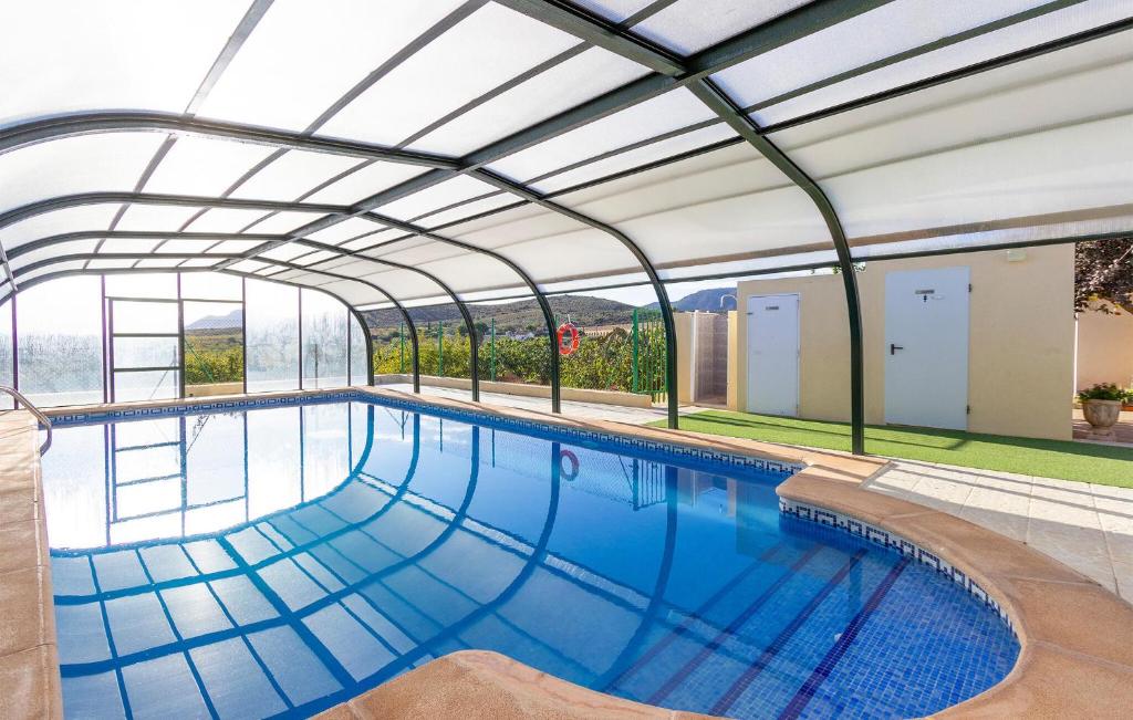 an indoor swimming pool with a glass roof at Cartagena, Perin in Perín