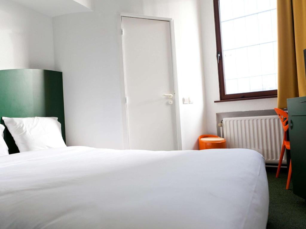 Postel nebo postele na pokoji v ubytování Hotel Siru Brussels