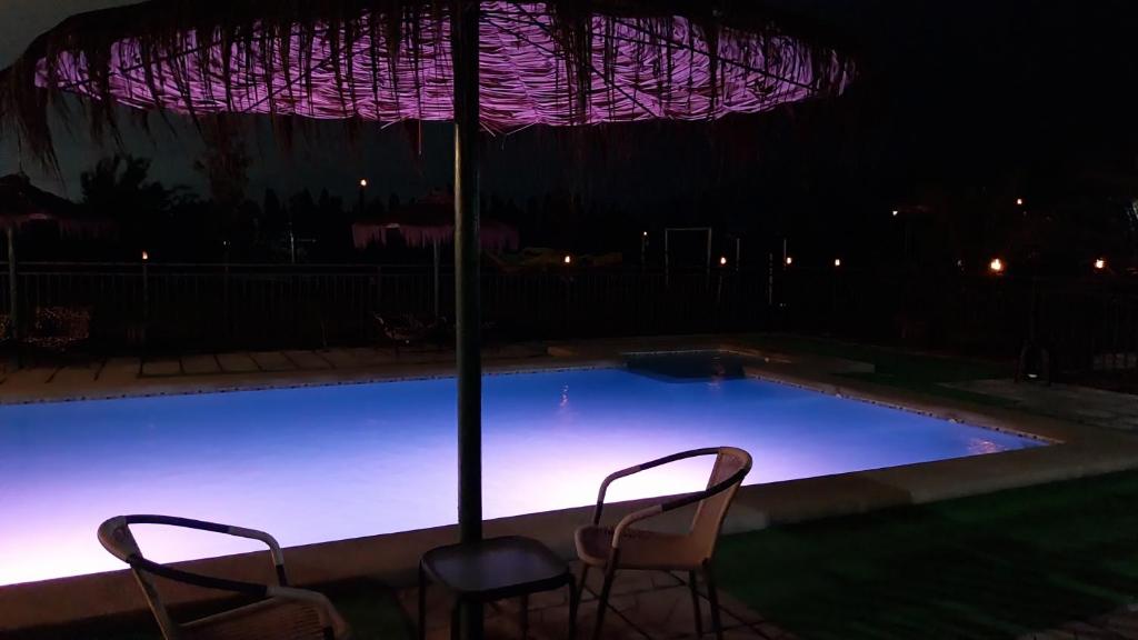 Bazén v ubytování Noche romántica nebo v jeho okolí