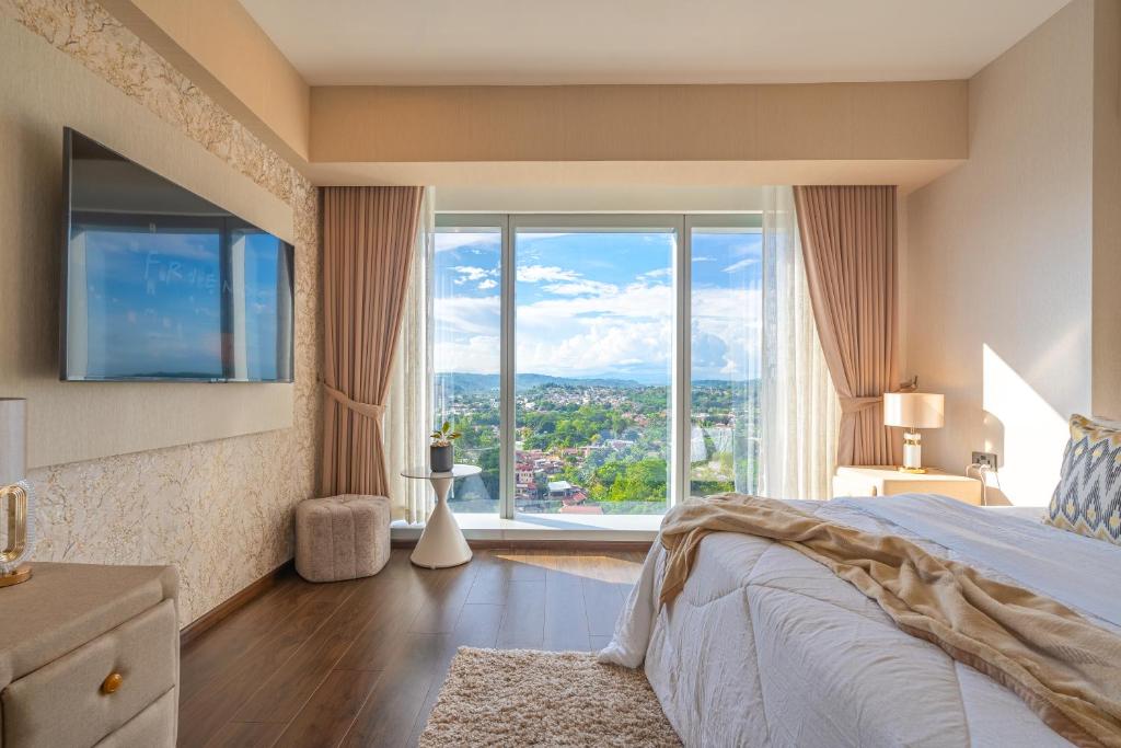Postel nebo postele na pokoji v ubytování Aeon Towers Apartments I Next to Abreeza Ayala Malls I Prime Location l Fast Wifi l Free Pool I Managed by Bleuspace