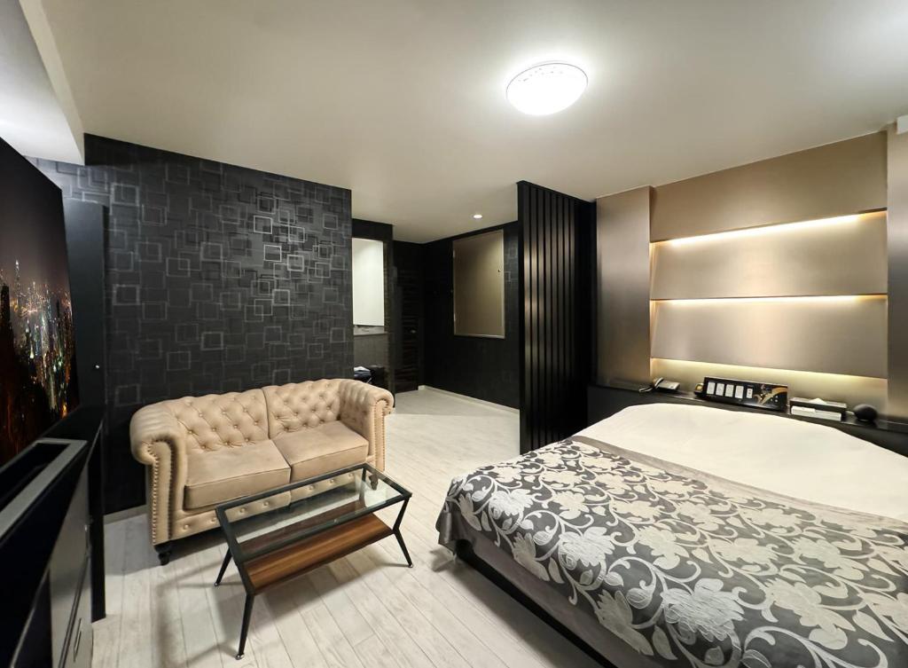 Postel nebo postele na pokoji v ubytování Hotel Gran Villa