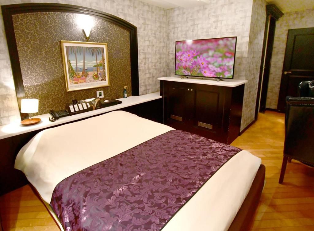 Postel nebo postele na pokoji v ubytování Hotel Gran Villa
