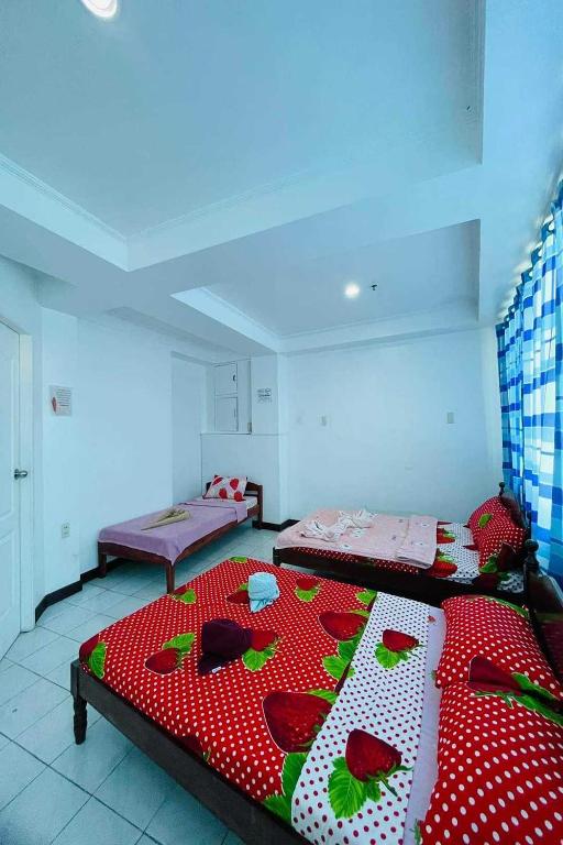 Postel nebo postele na pokoji v ubytování Istroberi Inn Palawan near Airport