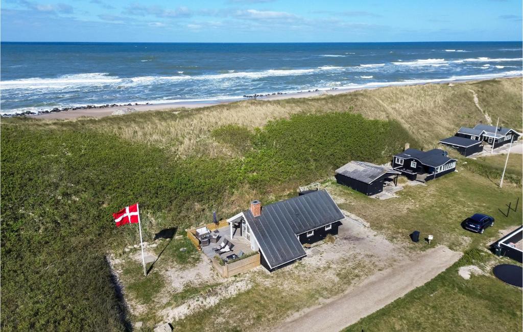 an aerial view of a house and the beach at Stunning Home In Ulfborg With Kitchen in Ulfborg