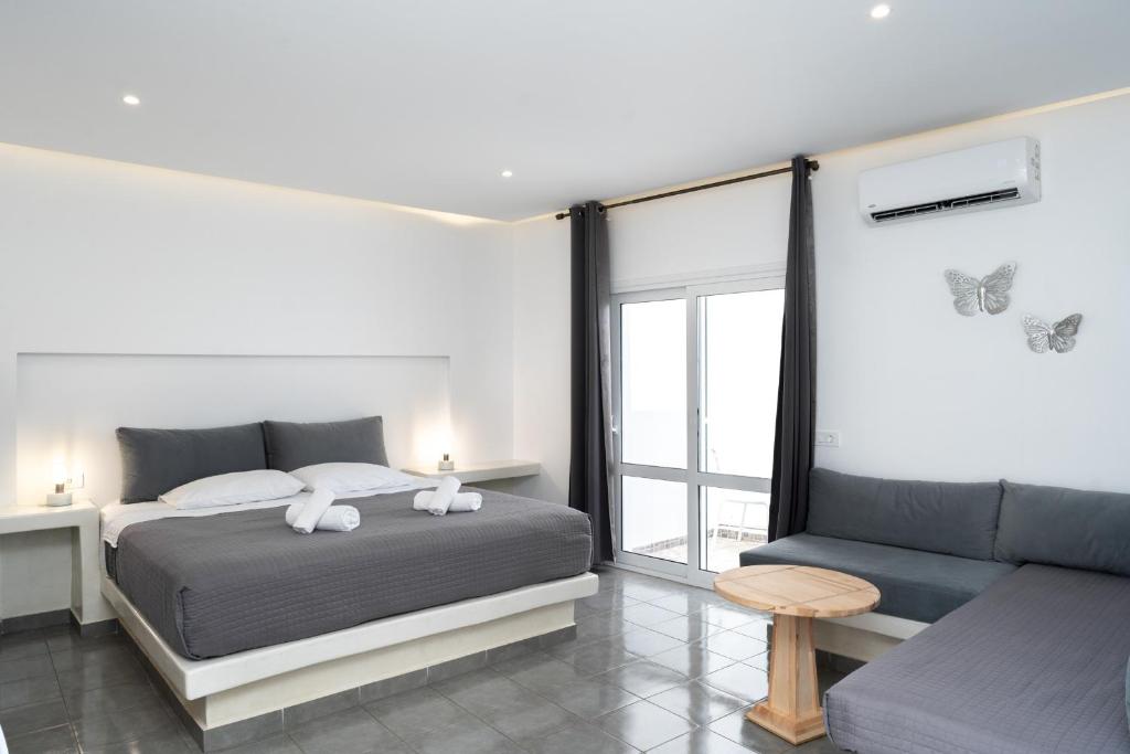 Postel nebo postele na pokoji v ubytování ILIADA-ODYSSEAS RESORT