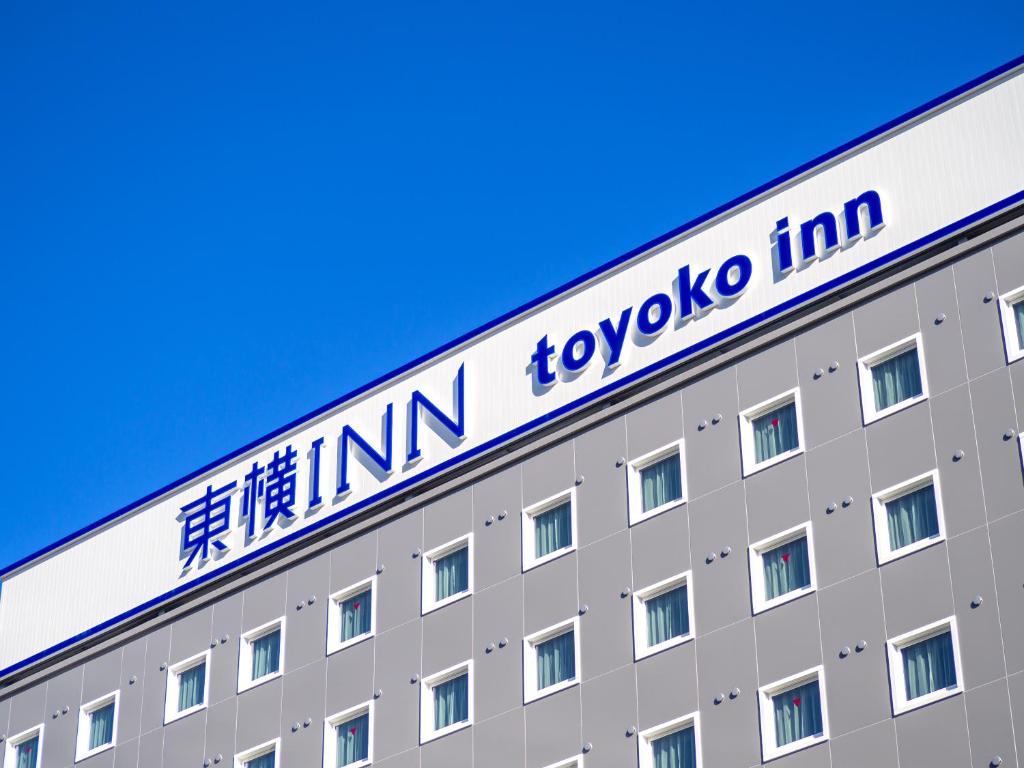 a sign on the side of a building at Toyoko Inn Chubu International Airport No1 in Tokoname