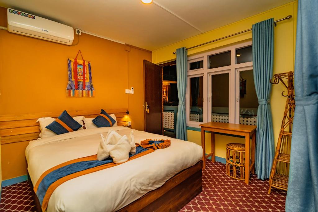 Postel nebo postele na pokoji v ubytování Kwabahal Garden Hostel