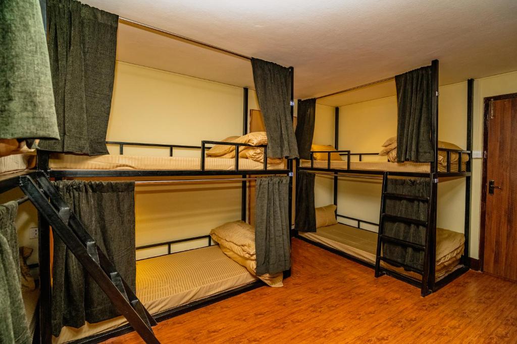 Postel nebo postele na pokoji v ubytování Kwabahal Garden Hostel