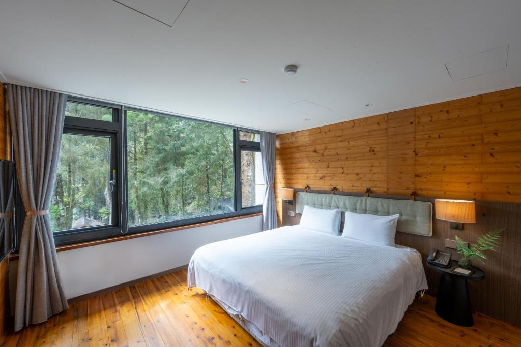 Postel nebo postele na pokoji v ubytování Howard Resort Xitou