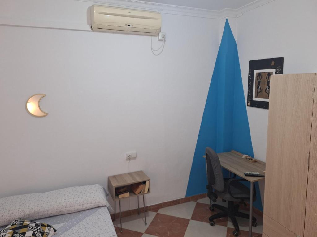 Televízia a/alebo spoločenská miestnosť v ubytovaní Ikigai House