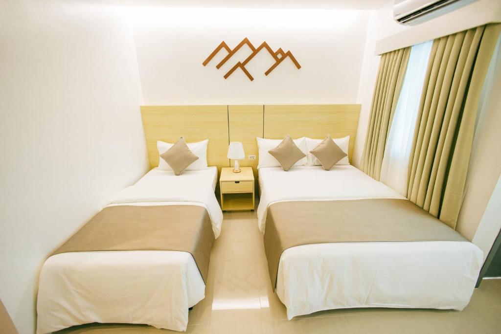 Postel nebo postele na pokoji v ubytování Panglao Vista Suites by SMS Hospitality